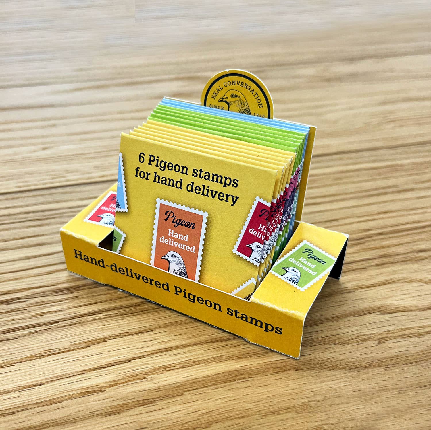 Counter-top box and 12 packs of hand-delivered Pigeon stamps